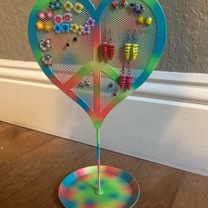 Tie dye peace sign earring holder.